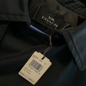 This is a Mens Coach Coat made out of great material. Never worn tags attached.